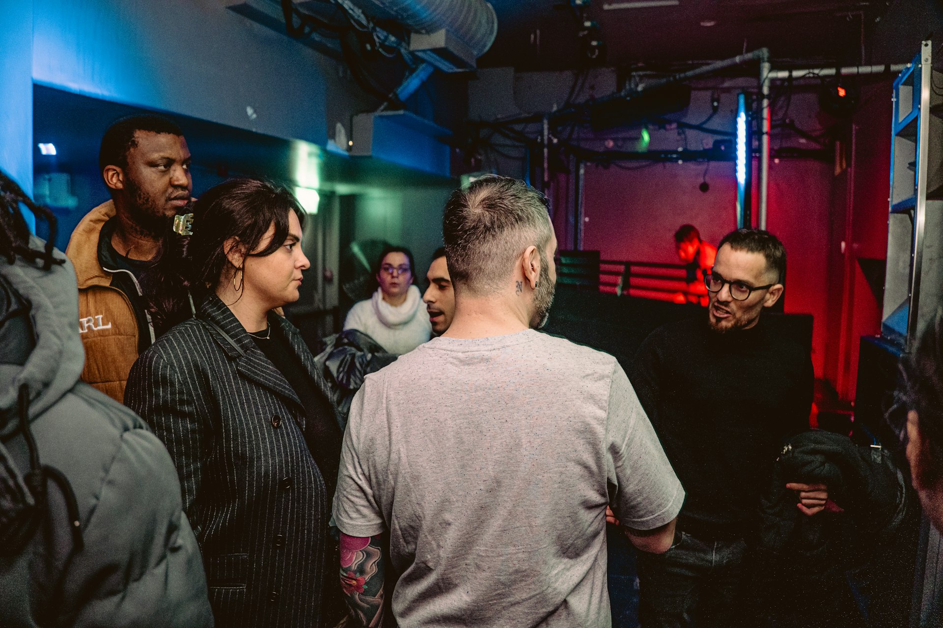 A group of people standing in a room